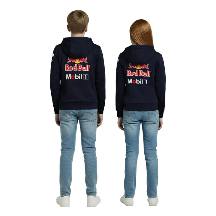 Two kids wear navy and night-sky-blue Oracle Red Bull Racing 2026 Team Full Zip Hoodies with Red Bull and Mobil logos, one facing forward and one facing backward.
