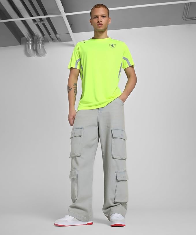 Front view of PUMA Scuderia Ferrari Yellow Hi-Vis Team Set Up T-Shirt featuring Ferrari Shield and PUMA Cat logo on chest, lightweight reflective racing tee for motorsport fans