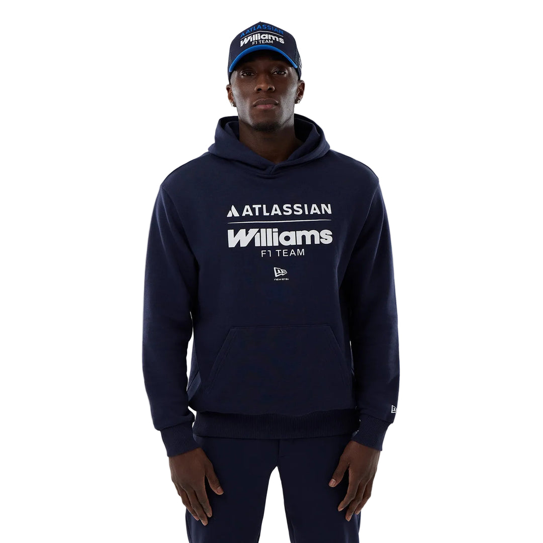 A Williams F1 Team F1  fan wearing a navy hoodie with 'Atlassian Williams F1 Team' in navy blue