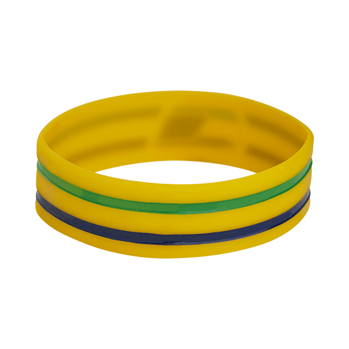 Ayrton Senna Brazil F1 Helmet PVC Bracelet Yellow Wristband - FANABOX Silicone wristband featuring a dominant Senna helmet and Brazilian flag colors with a yellow band with two accent bands in green and dark blue, shown against a plain white background.