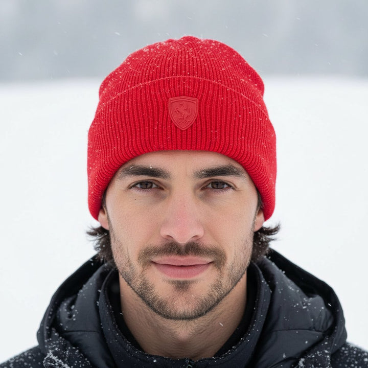 Ferrari fam wearing a red beanie with a Scuderia Ferrari F1 Praning Horse matted logo against a snowy background in Montreal 