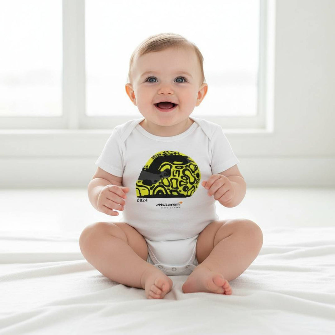 Baby wearing a white onesie from McLaren F1™Team Lando Norris Helmet Baby Onesie Bodysuit - White 