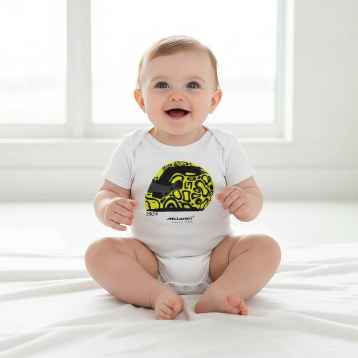Baby wearing a white onesie from McLaren F1™Team Lando Norris Helmet Baby Onesie Bodysuit - White 