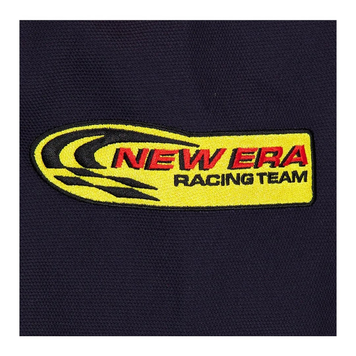 Close-up of the yellow and red New Era Racing Team embroidered patch on the black Red Bull Racing motorsport jacket.
