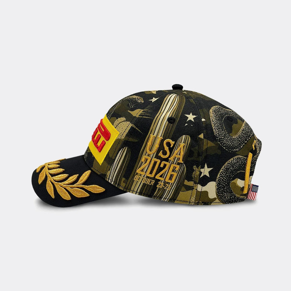 A Pirelli F1 2026 Austin USA GP Podium Hat – featuring a black and olive green camouflage pattern with gold embroidered laurel leaves on the brim, a red and yellow "Pirelli" patch on the side, and 'USA 2026' text printed on the front. A small American flag tag is visible on the back strap.