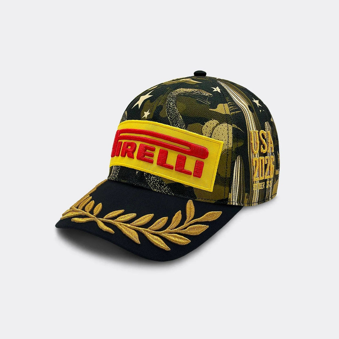 A 2026 F1 Austin GP hat by Pirelli featuring a dark green and black camouflage pattern with gold stars, a yellow front patch with red Pirelli branding, and gold embroidered laurel leaves on the brim.