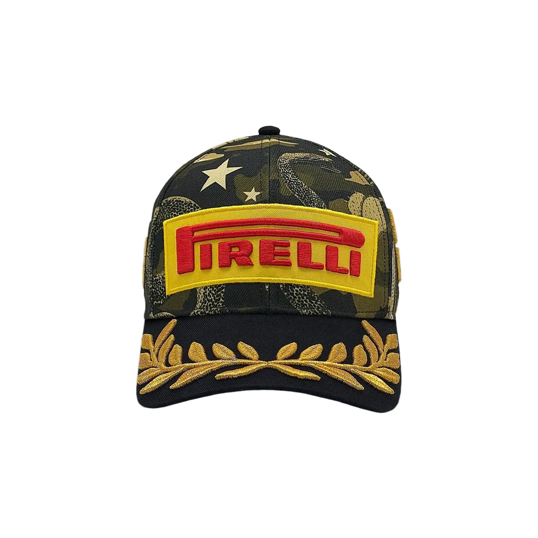 A Pirelli F1 2026 Austin GP Podium Cap – USA Grand Prix baseball cap featuring a dark camouflage pattern with gold stars, a prominent yellow and red Pirelli logo patch on the front, and gold embroidered laurel leaves on the brim.