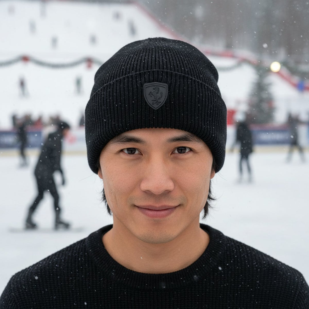 As an Asian male F1 fan wearing a Ferrari black knit beanie with a logo on an ice rink in the background