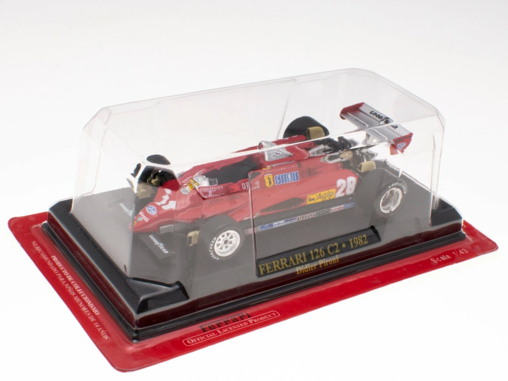 Model car 1:43 scale of a Ferrari 126 C2 on a red display base with a clear cover