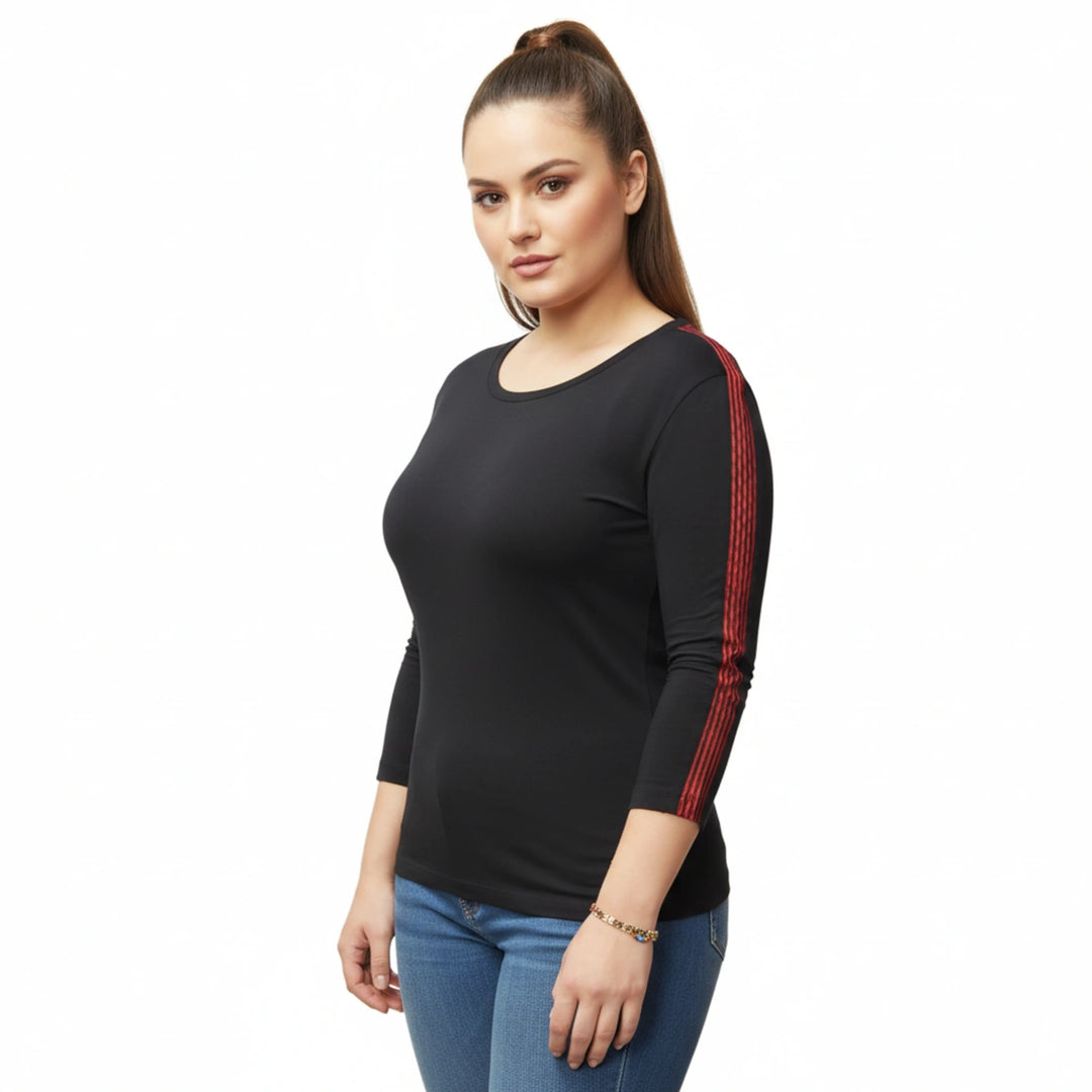 Ferrari F1 women’s black long sleeve top showing modern fit and subtle racing-inspired red sleeve stripes