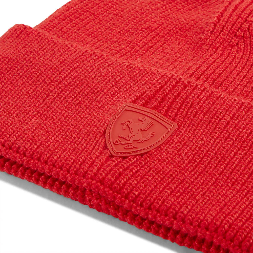 Red knit Ferrari Formula 1 beanie with a logo on a white background by Puma
